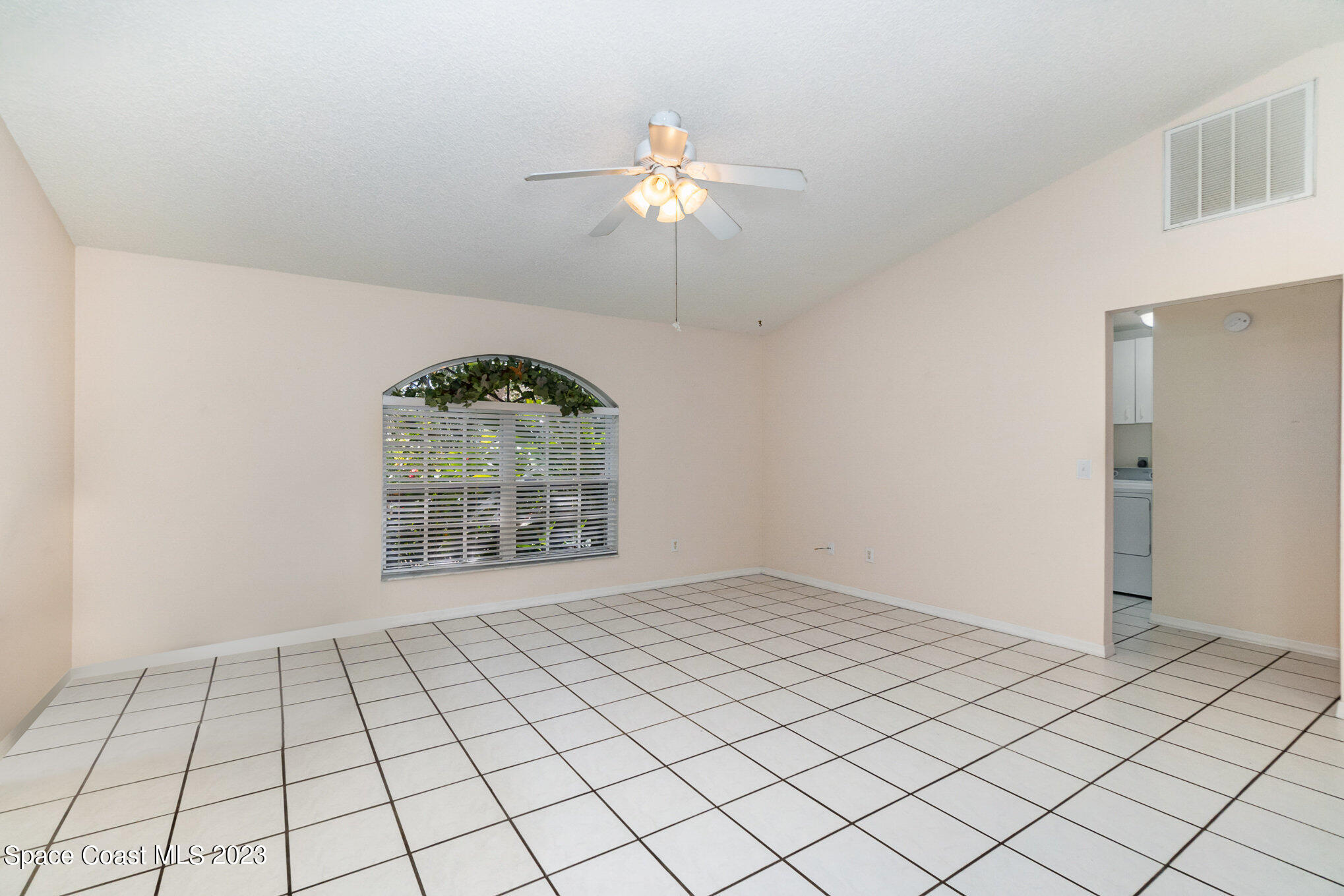 2399 Angel Road Palm Bay, FL 32909 - Photo 5 of 26 a view of an empty room and window