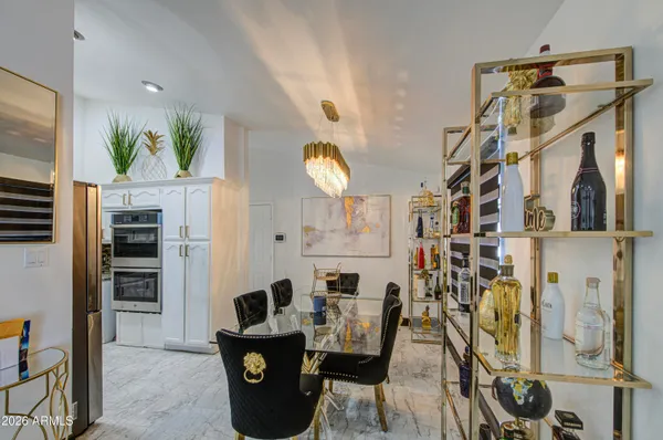 a view of a livingroom with furniture and a flat screen tv