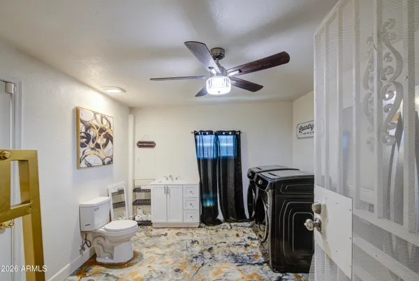 a living room with a couch and a chandelier