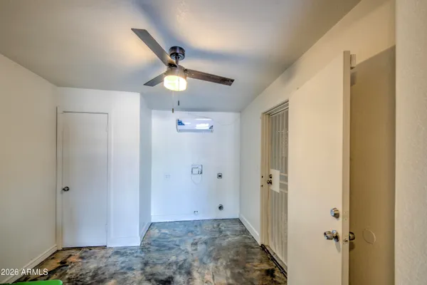 a view of a hallway with closet and wooden floor