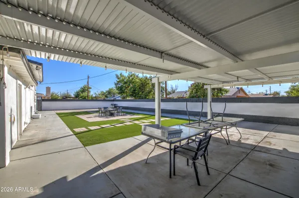 a view of a swimming pool with a patio