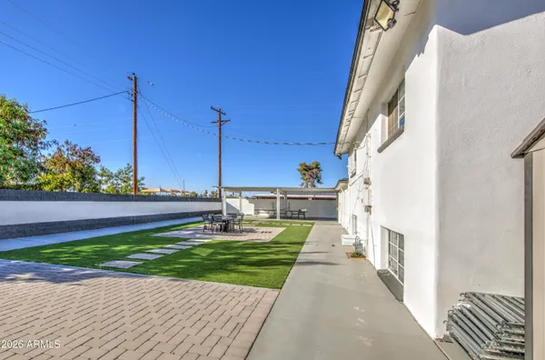 a view of a house with a yard and front door