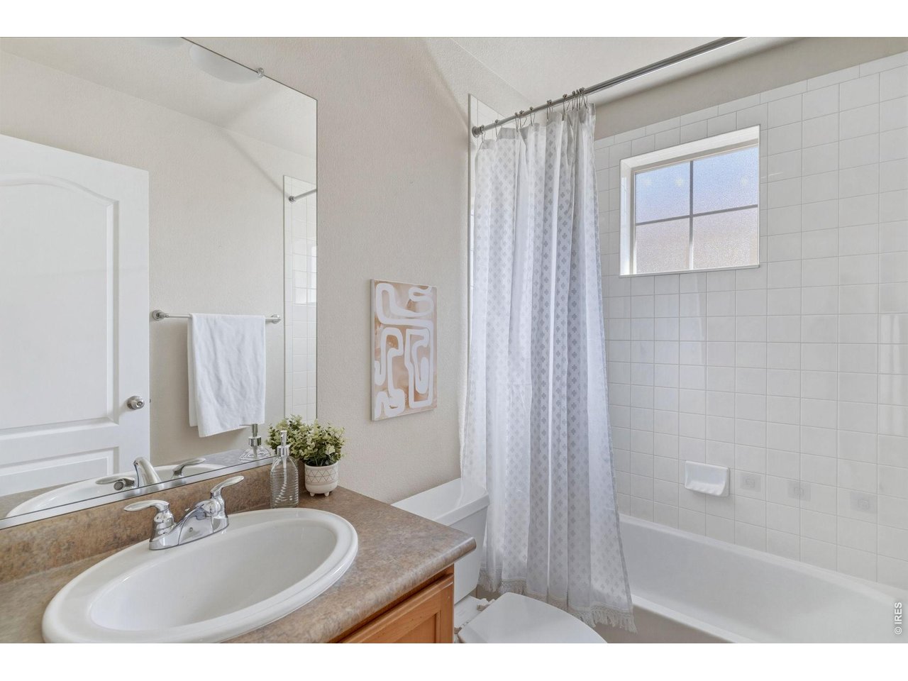 654 Homestead Street Lafayette, CO 80026 - Photo 20 of 31 a bathroom with a sink and a mirror