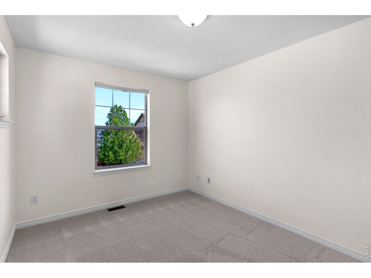 654 Homestead Street Lafayette, CO 80026 - Photo 21 of 31 a view of an empty room with a window