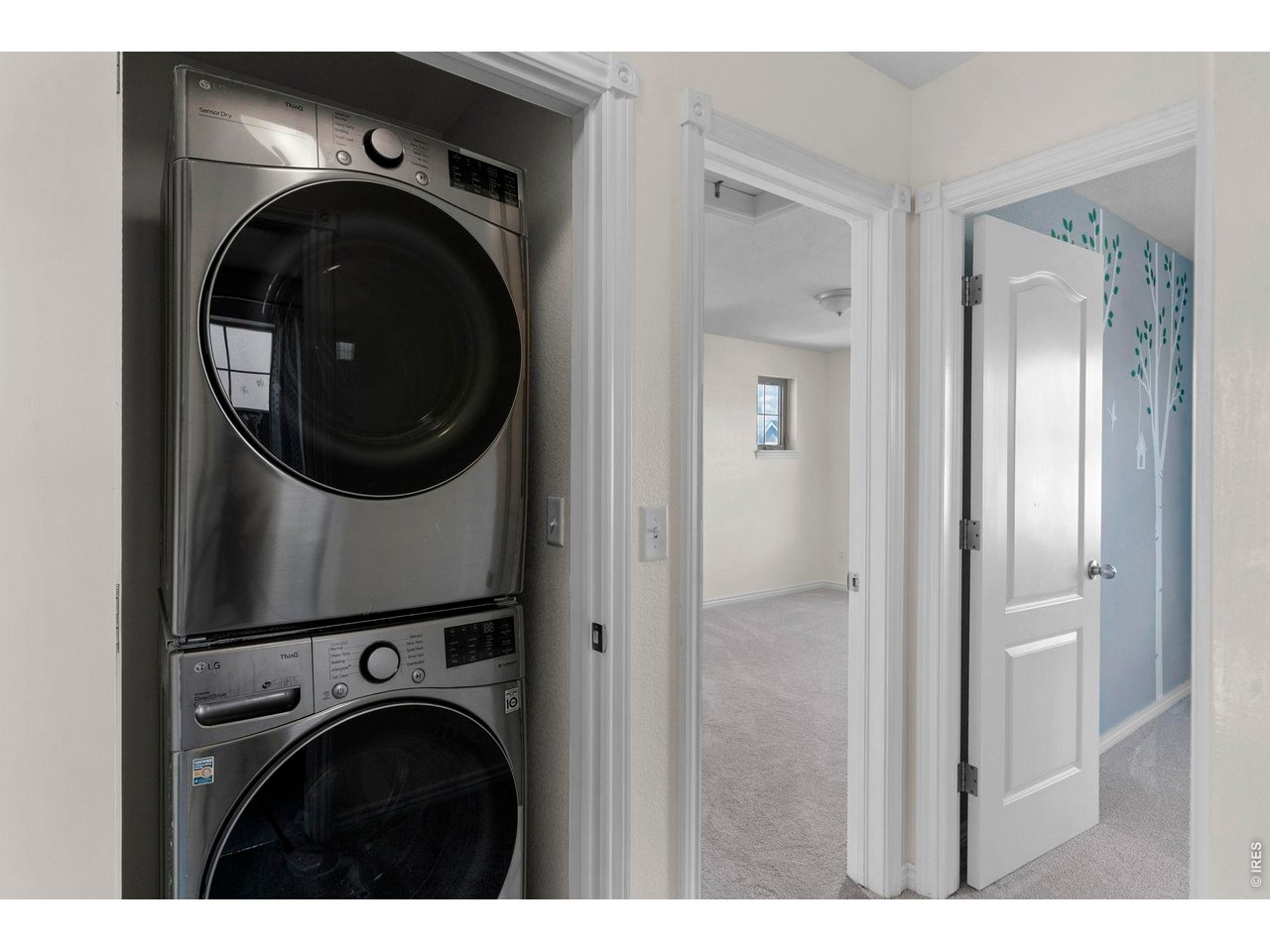 654 Homestead Street Lafayette, CO 80026 - Photo 22 of 31 a view of a hallway with washer and dryer