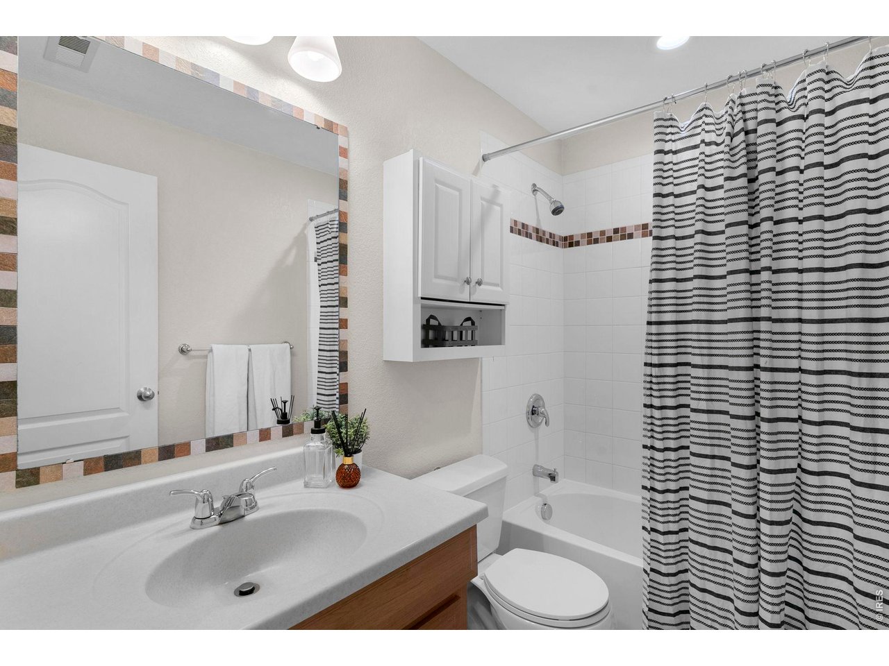 654 Homestead Street Lafayette, CO 80026 - Photo 25 of 31 a bathroom with a sink a toilet and shower