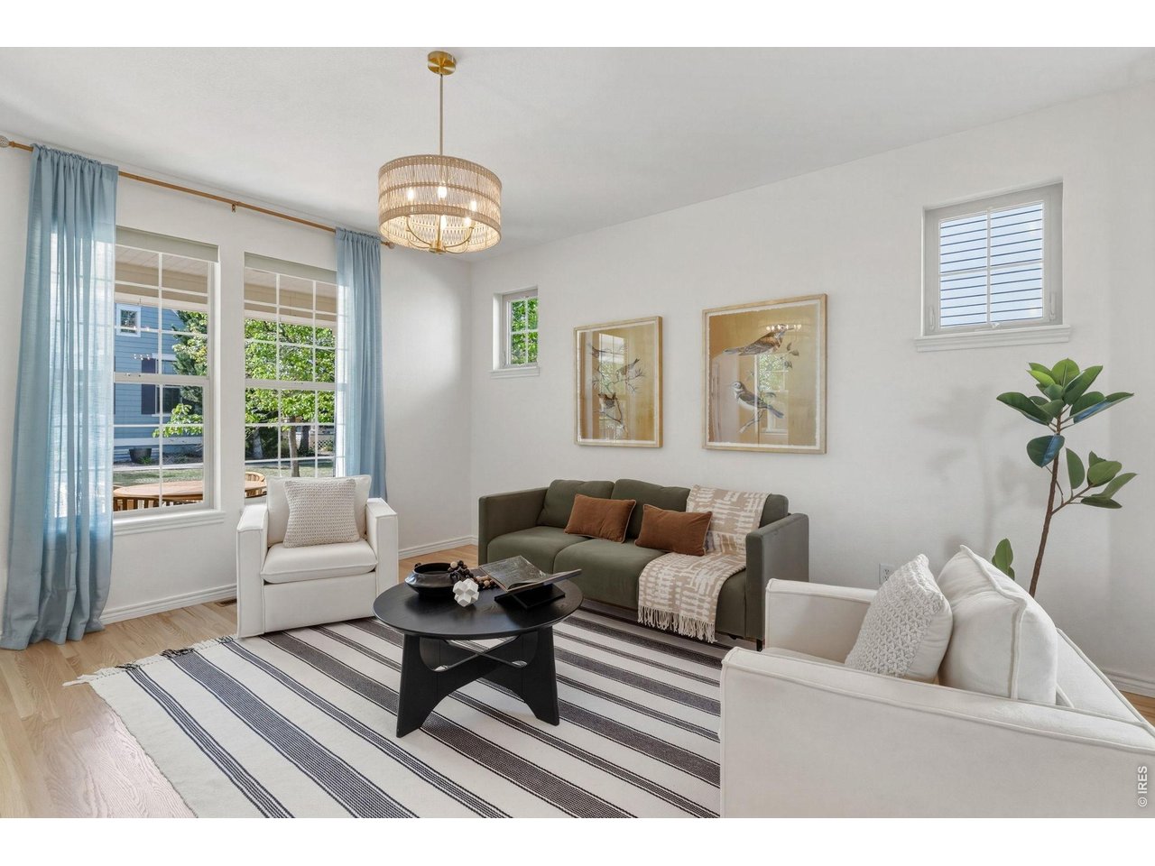 654 Homestead Street Lafayette, CO 80026 - Photo 6 of 31 a living room with furniture a window and a dining table