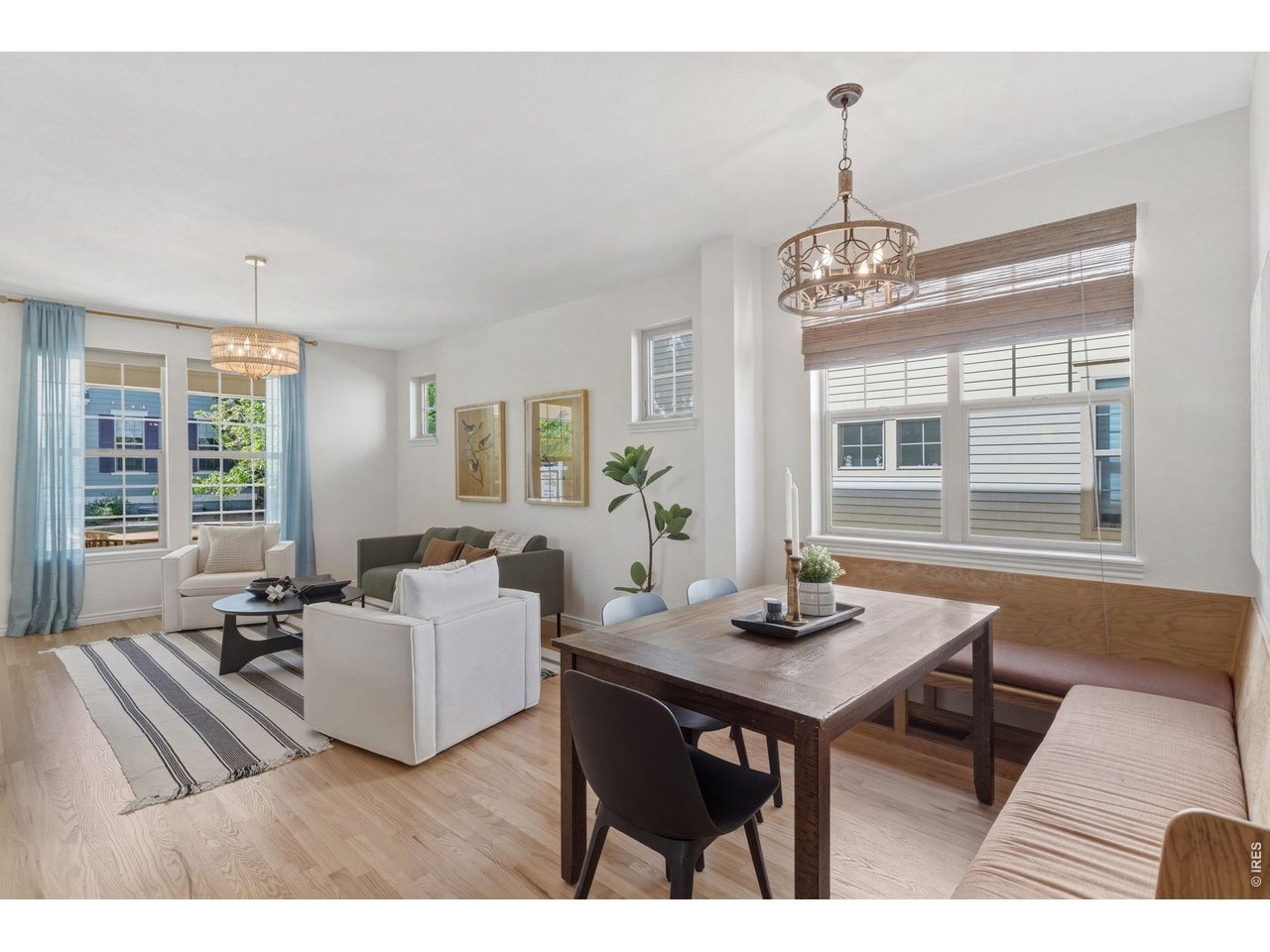 654 Homestead Street Lafayette, CO 80026 - Photo 7 of 31 a living room with furniture wooden floor and floor to ceiling windows