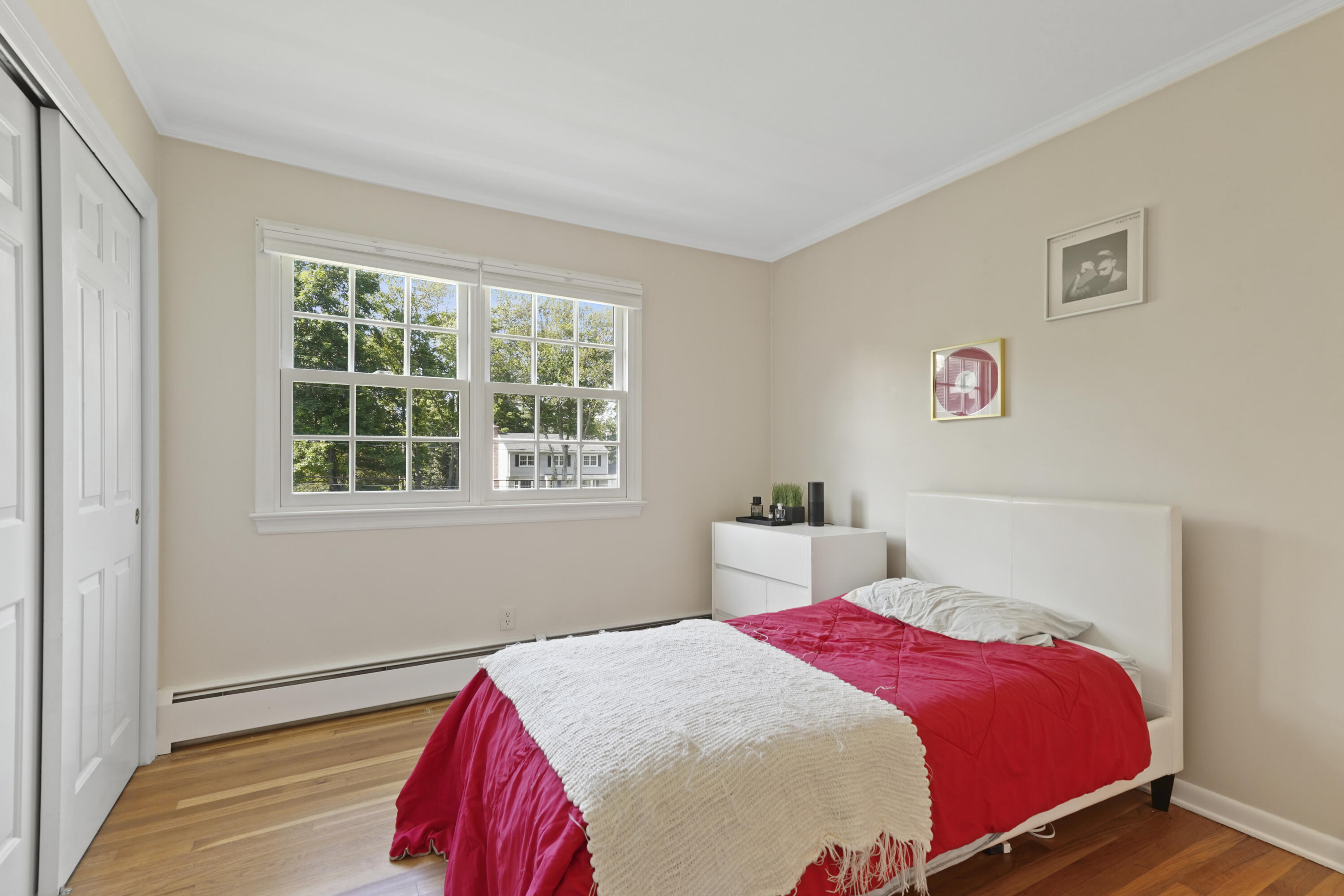 34 Summit Ridge Road New Canaan, CT 06840 - Photo 17 of 28 a bedroom with a bed and a window