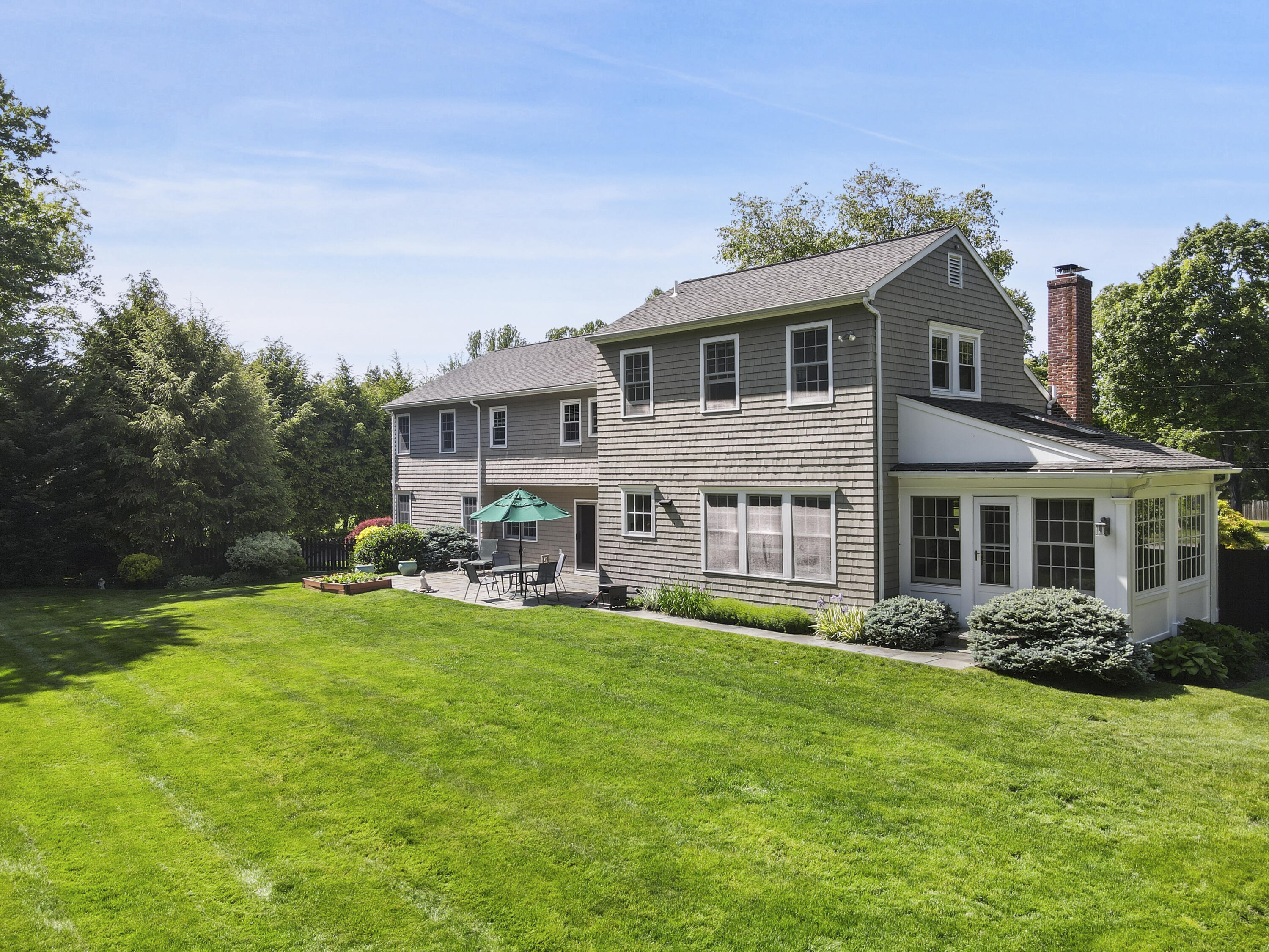 34 Summit Ridge Road New Canaan, CT 06840 - Photo 20 of 28 a view of a house with a yard and sitting area