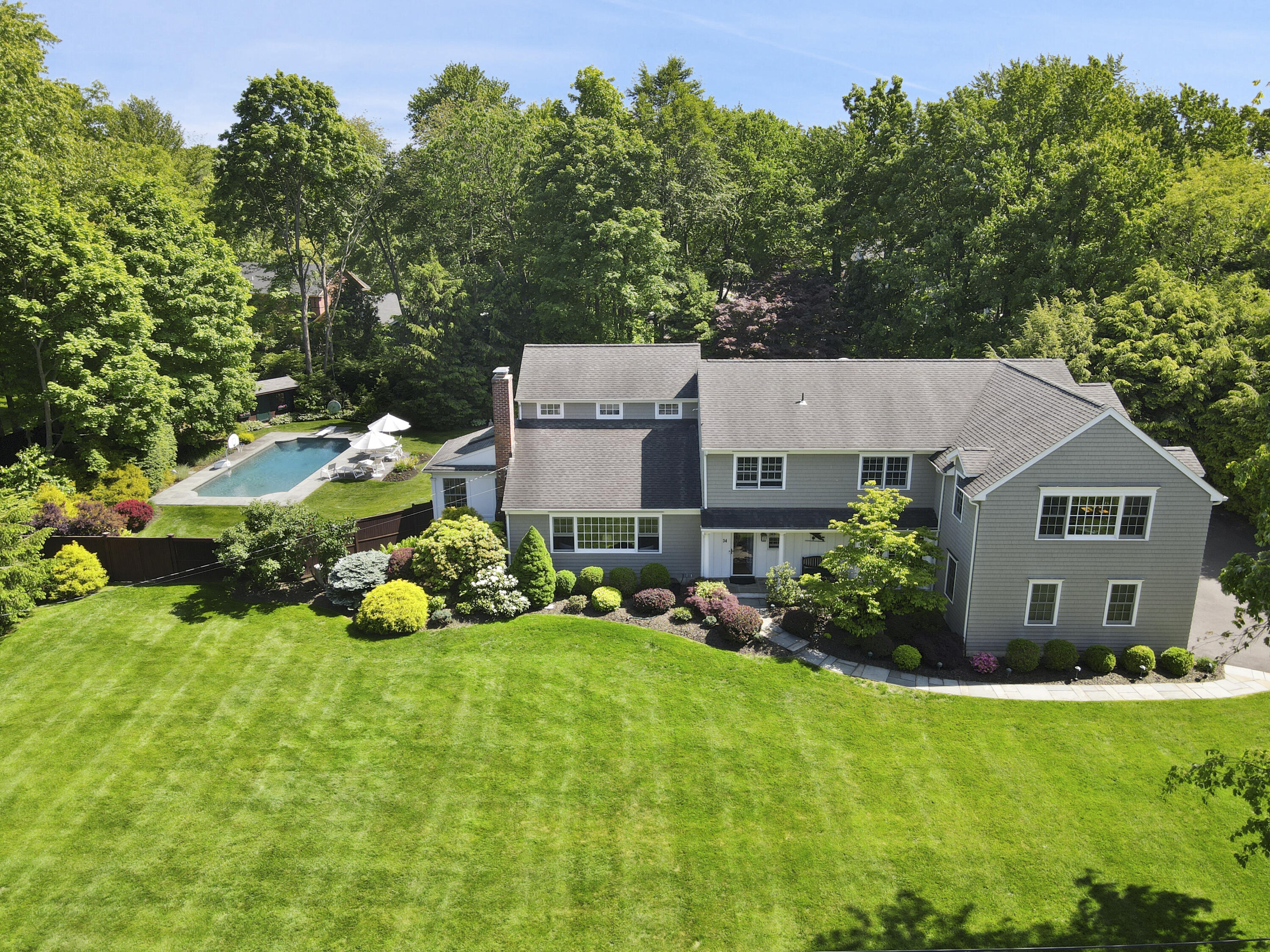 34 Summit Ridge Road New Canaan, CT 06840 - Photo 2 of 28 a aerial view of a house