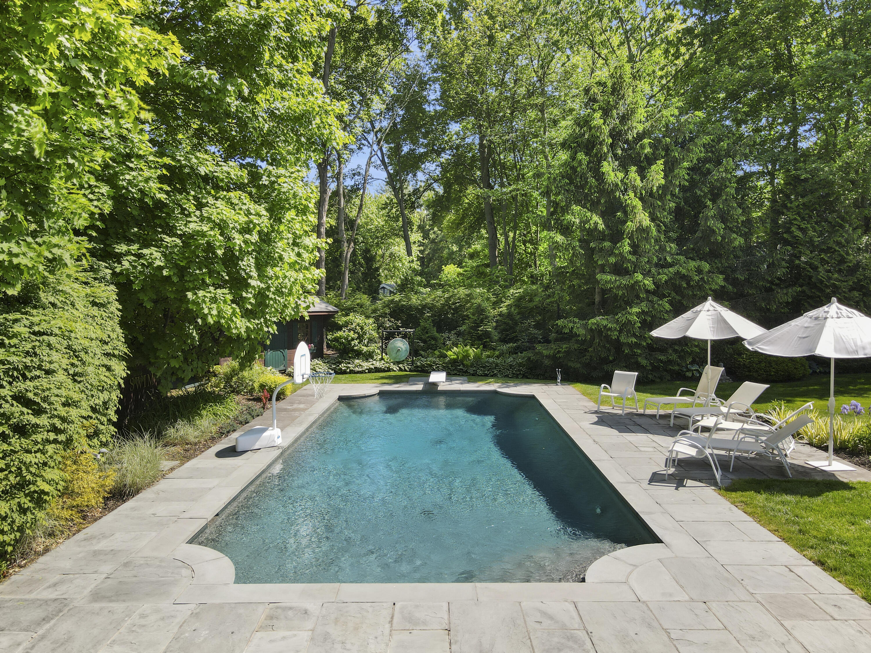 34 Summit Ridge Road New Canaan, CT 06840 - Photo 24 of 28 a view of swimming pool with lounge chair
