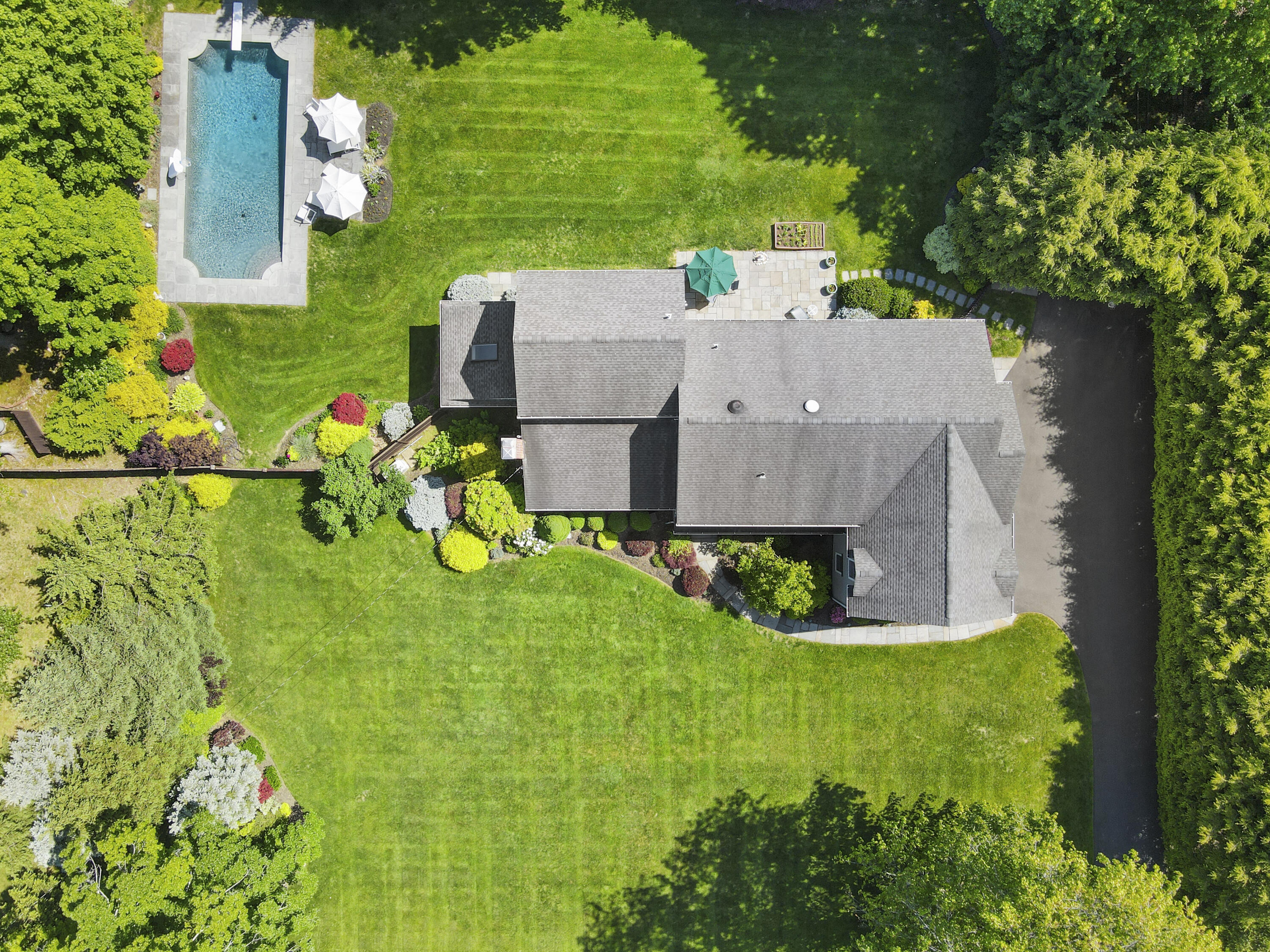 34 Summit Ridge Road New Canaan, CT 06840 - Photo 25 of 28 an aerial view of a house with big yard