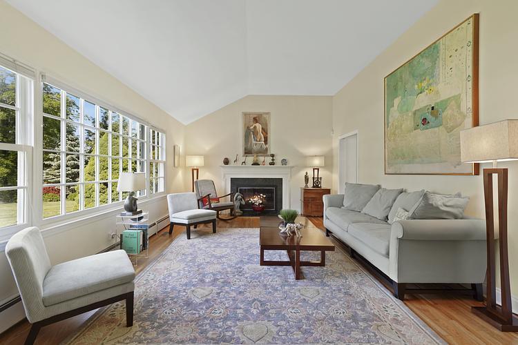 34 Summit Ridge Road New Canaan, CT 06840 - Photo 3 of 28 a living room with furniture and a fireplace