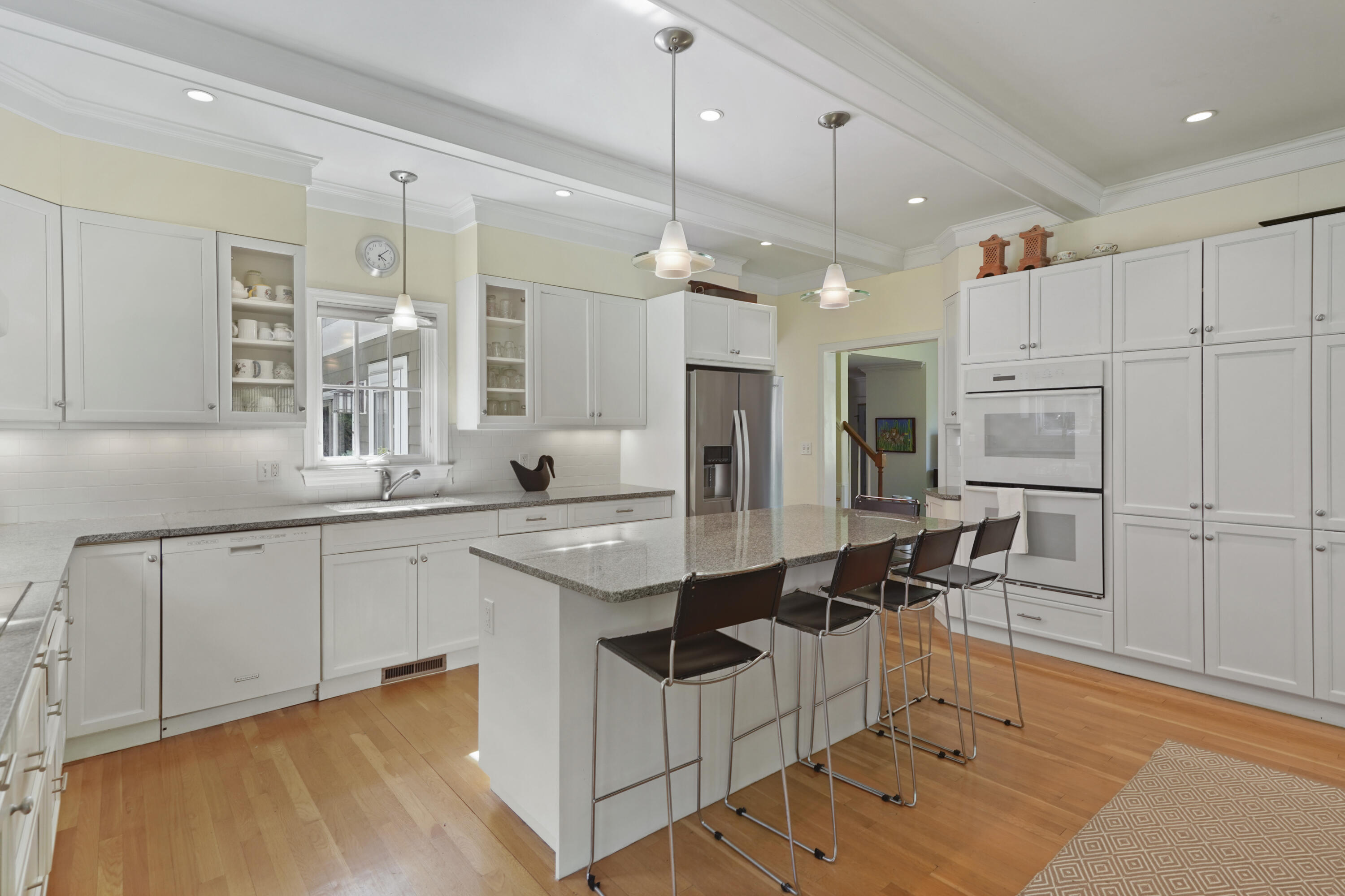 34 Summit Ridge Road New Canaan, CT 06840 - Photo 6 of 28 a kitchen with kitchen island granite countertop a sink cabinets and stainless steel appliances
