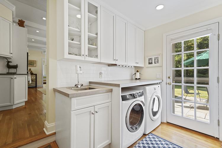 34 Summit Ridge Road New Canaan, CT 06840 - Photo 9 of 28 a view of a kitchen with washer and dryer