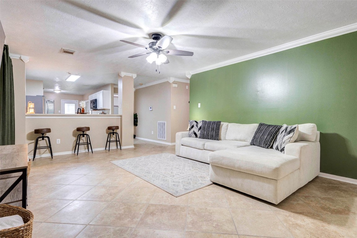 822 Autumn Point Lane Spring, TX 77373 - Photo 7 of 26 Open living room. Accent wall can be painted to match the home if you like.