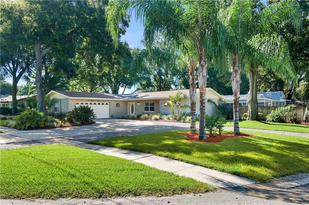 611 Overhill Drive Brandon, FL 33511 - Photo 1 of 1 a view of a big yard with plants and large trees