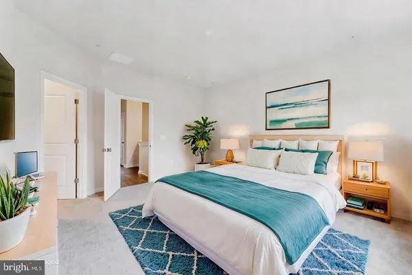 a bedroom with a bed and a couch