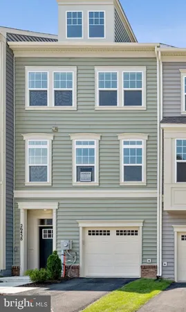 a view of a building next to a yard