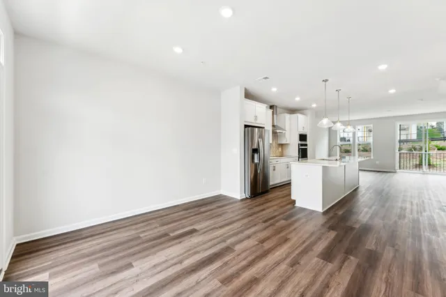 a view of kitchen view wooden floor and window