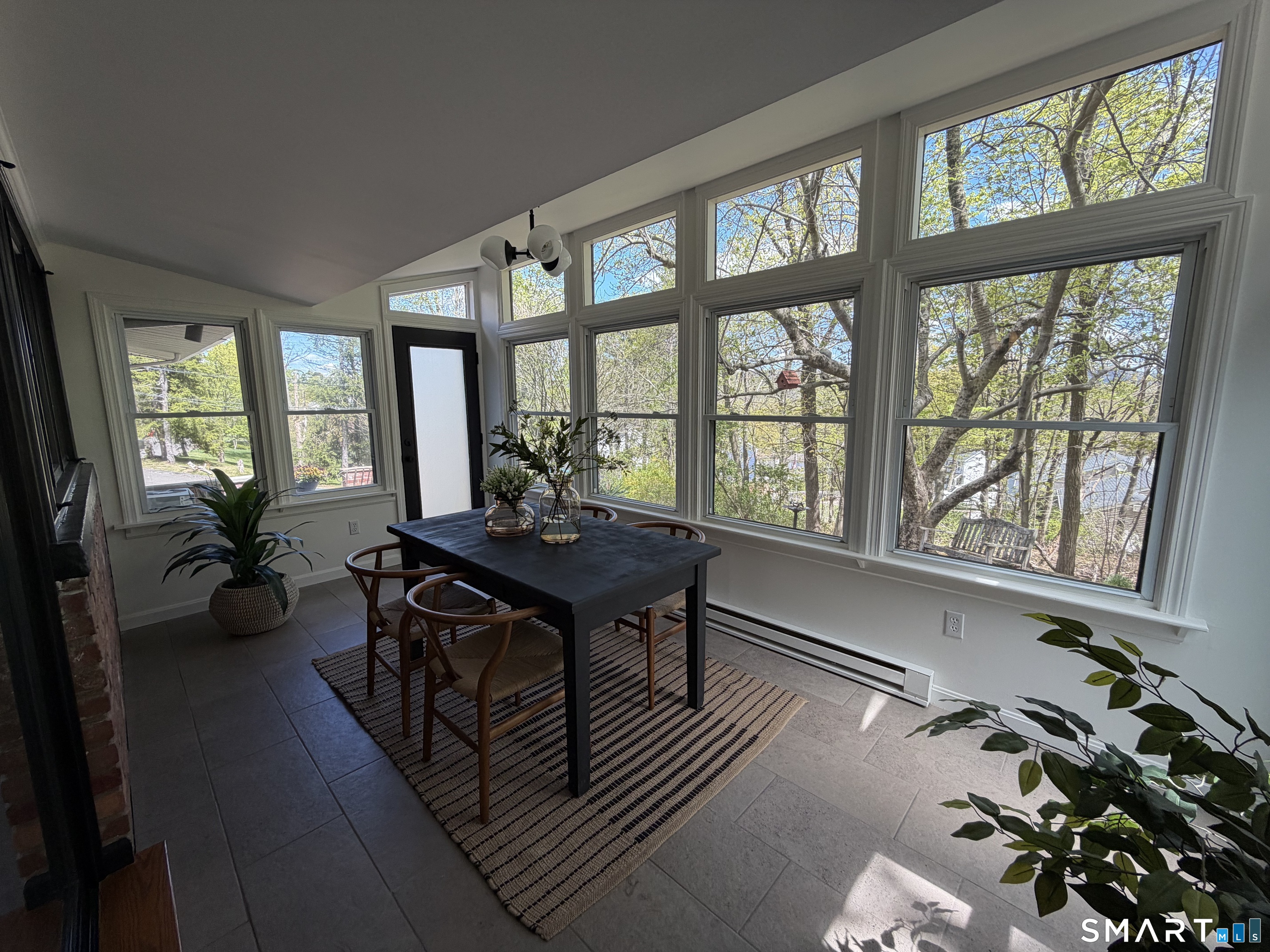 Undisclosed Address Meriden, CT 06451 - Photo 12 of 35 Privacy to many trees and views from this limestone floored room
