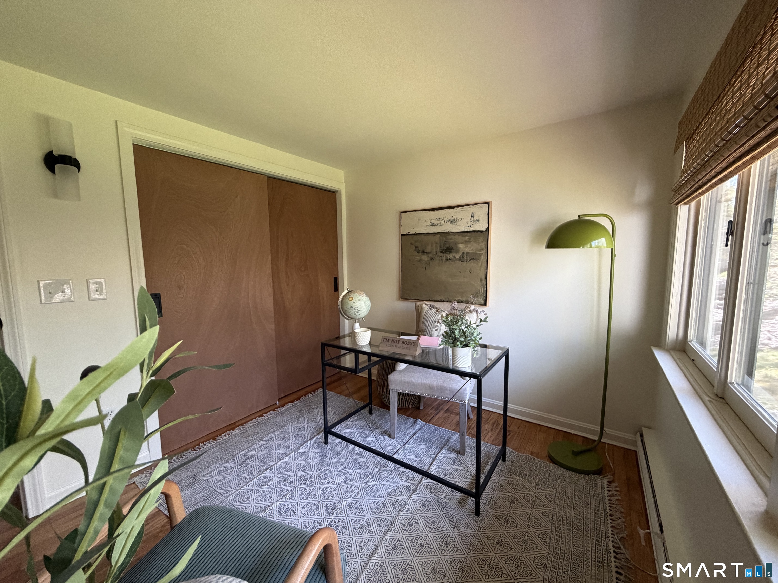 Undisclosed Address Meriden, CT 06451 - Photo 20 of 35 Rear bedroom staged as an office or can easily be bedroom with double closet , view of nature