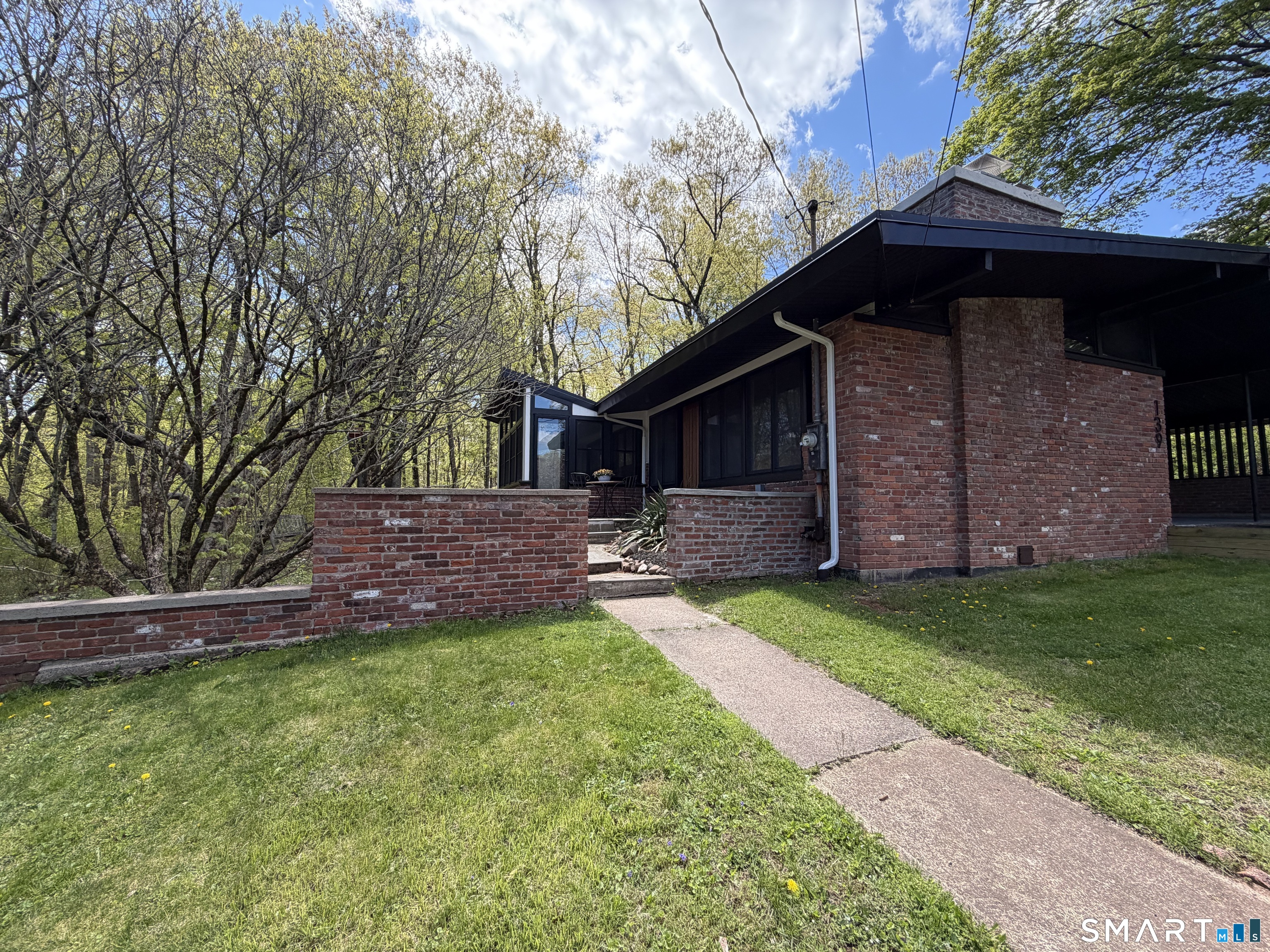 Undisclosed Address Meriden, CT 06451 - Photo 3 of 35 Sidewalk leads to front door or enclosed heated sunroom
