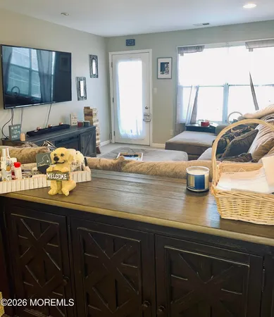 a kitchen with a sink a stove and cabinets