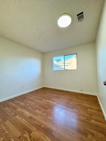 a bathroom with a double vanity sink toilet and shower
