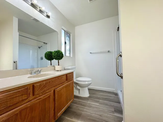 a view of a house with a yard and garage