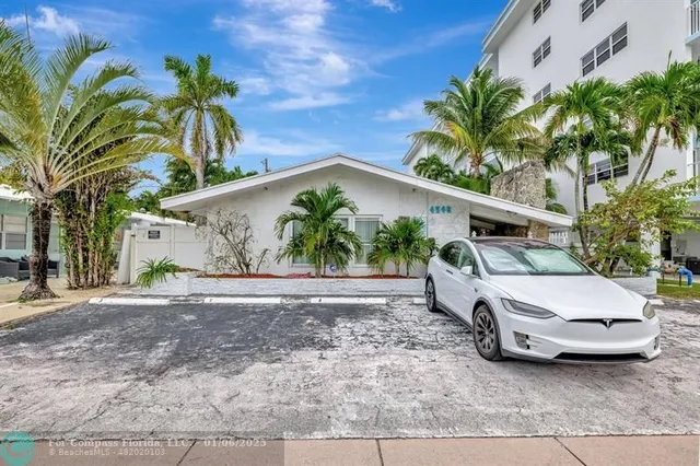 a view of a car parked in front of a house