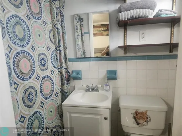 a kitchen with a sink appliances and cabinets