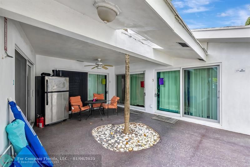 4548 North Ocean Drive, Unit 4 Lauderdale-by-the-Sea, FL 33308 - Photo 7 of 48 a living room with furniture and a fireplace
