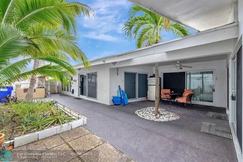 4548 North Ocean Drive, Unit 4 Lauderdale-by-the-Sea, FL 33308 - Photo 8 of 48 a view of a chair and table in the patio