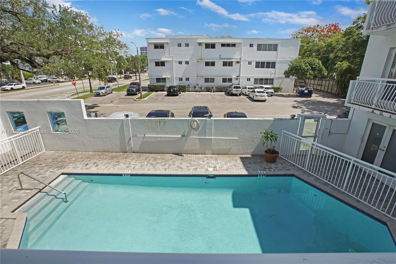 3101 Southwest 27th Avenue, Unit 203 Miami, FL 33133 - Photo 17 of 25 a view of a house with a yard and sitting area