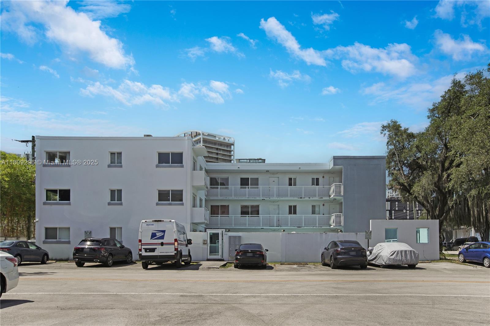 3101 Southwest 27th Avenue, Unit 203 Miami, FL 33133 - Photo 19 of 25 a view of building with cars parked