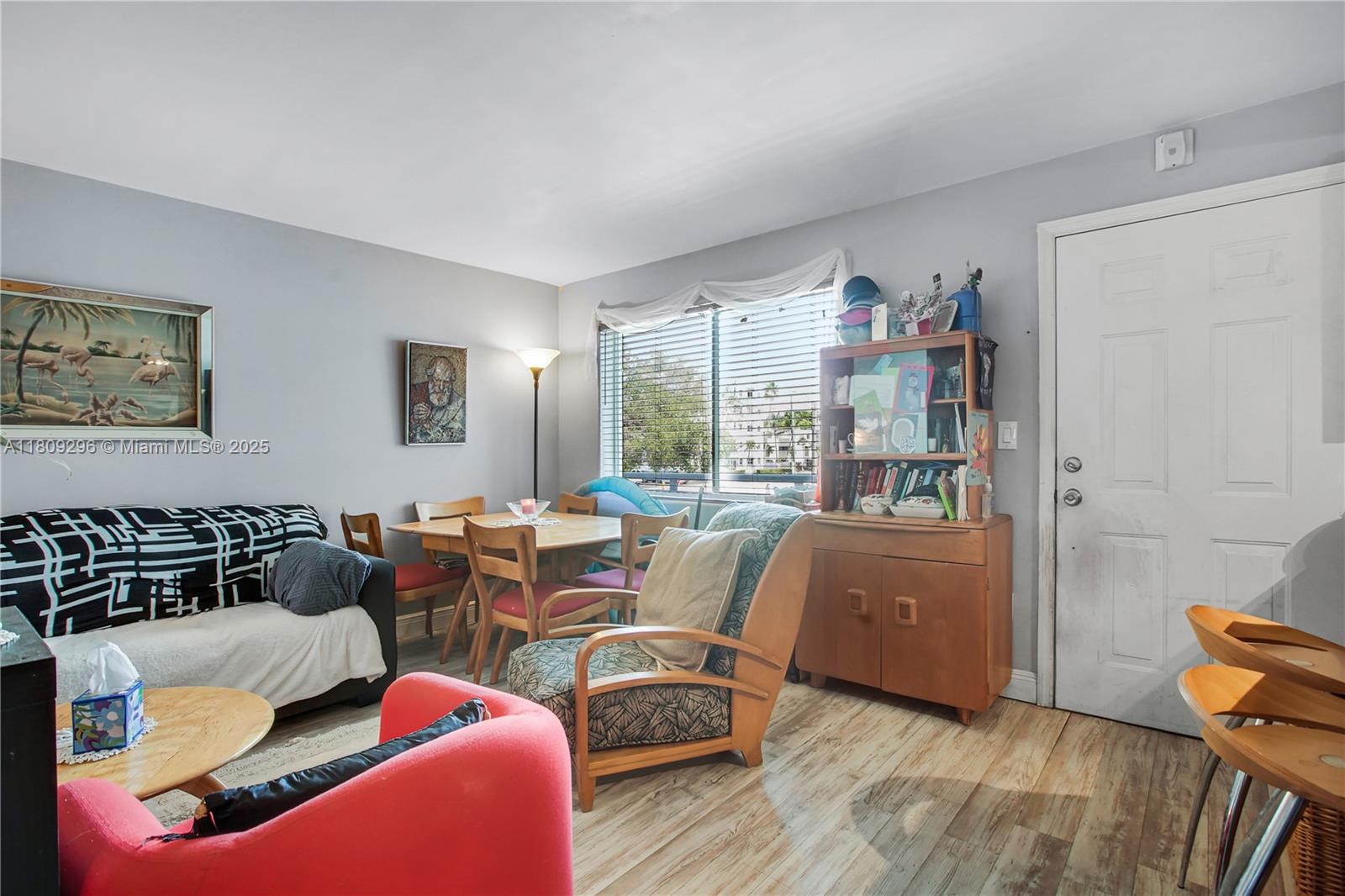 3101 Southwest 27th Avenue, Unit 203 Miami, FL 33133 - Photo 3 of 25 a living room with furniture and a window