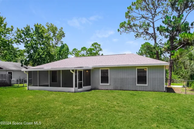 a view of a house with a garden