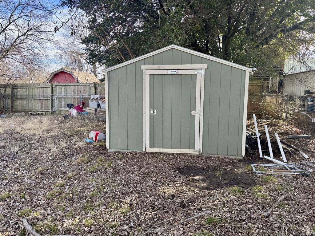 613 West Main Street Crowley, TX 76036 - Photo 26 of 30 View of shed featuring a fenced backyard