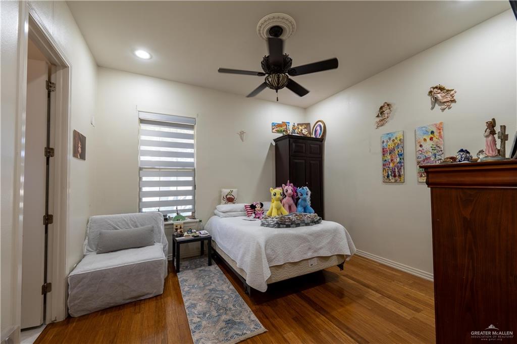 3801 South L Street McAllen, TX 78503 - Photo 11 of 38 a bedroom with a bed and a couch