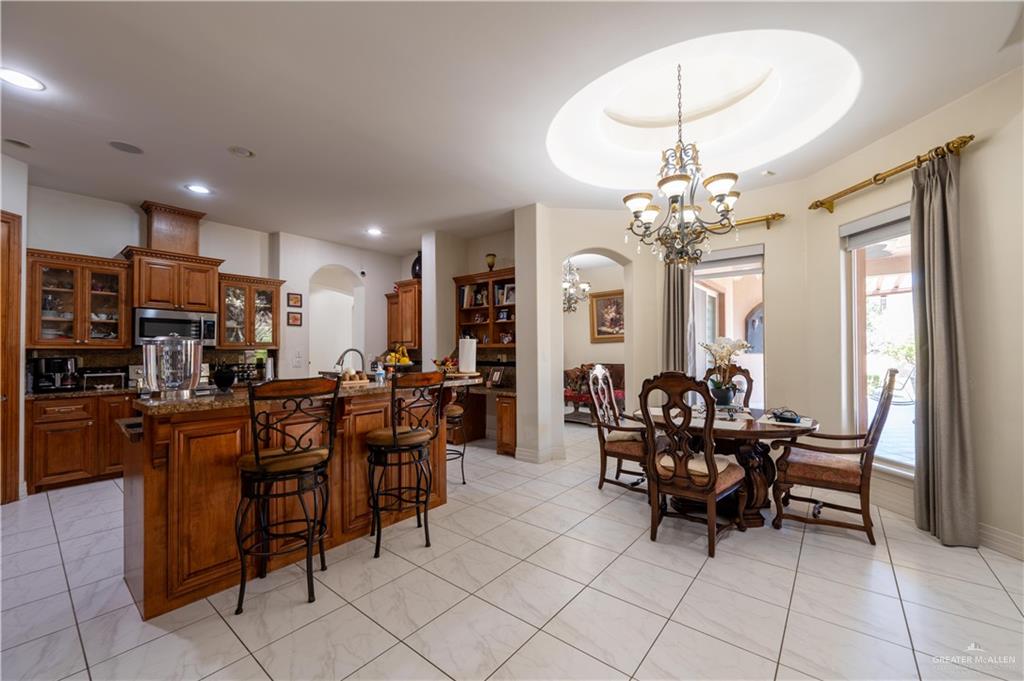3801 South L Street McAllen, TX 78503 - Photo 18 of 38 a view of a dining room with furniture