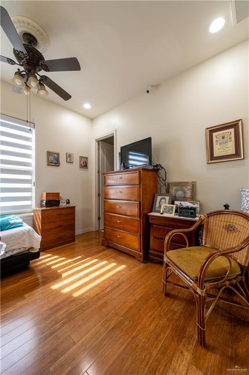 3801 South L Street McAllen, TX 78503 - Photo 21 of 38 a bedroom with furniture and a wooden floor