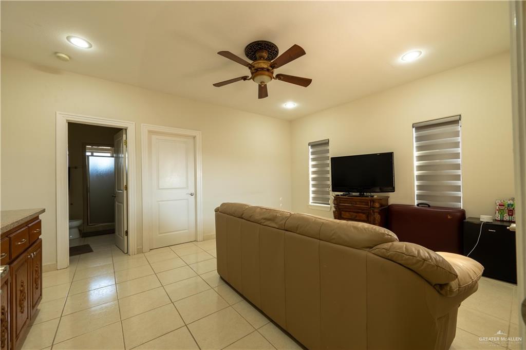 3801 South L Street McAllen, TX 78503 - Photo 26 of 38 a living room with furniture and a flat screen tv