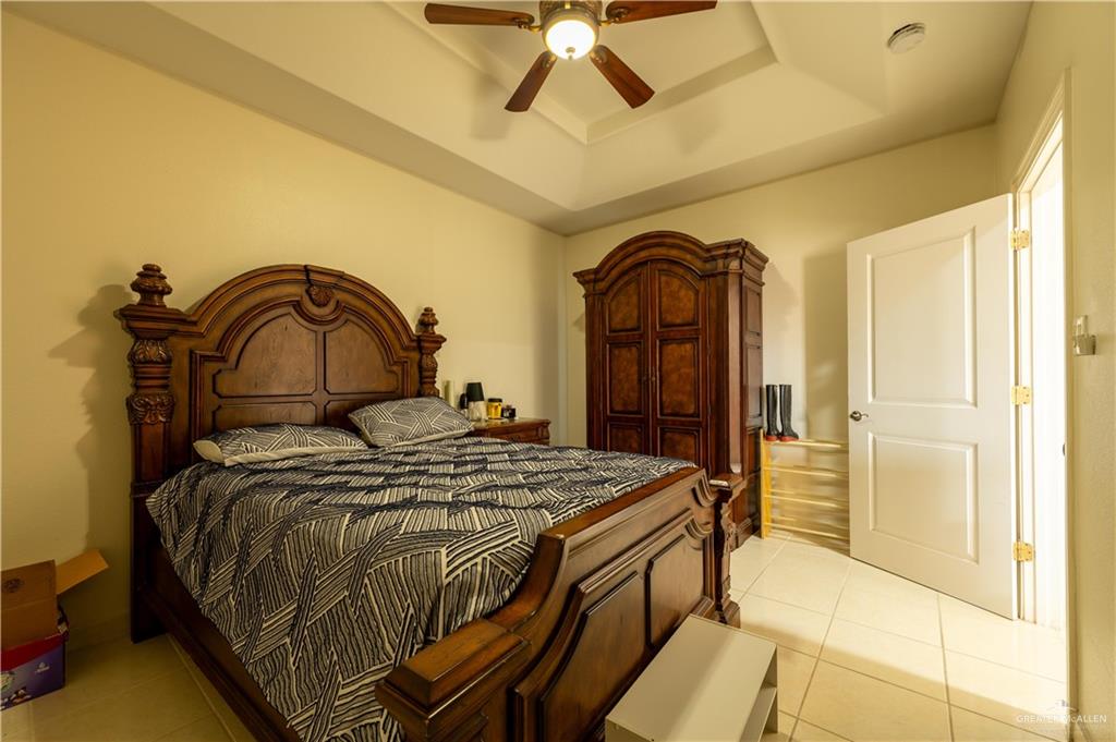 3801 South L Street McAllen, TX 78503 - Photo 27 of 38 a bedroom with a bed and a dresser
