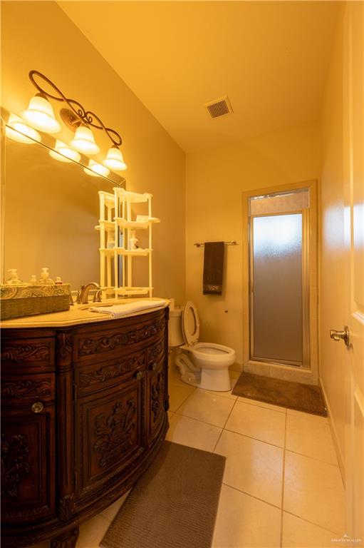 3801 South L Street McAllen, TX 78503 - Photo 28 of 38 a spacious bathroom with a granite countertop sink and a mirror