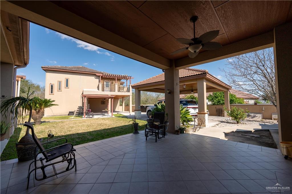 3801 South L Street McAllen, TX 78503 - Photo 30 of 38 a room with patio furniture and a fireplace