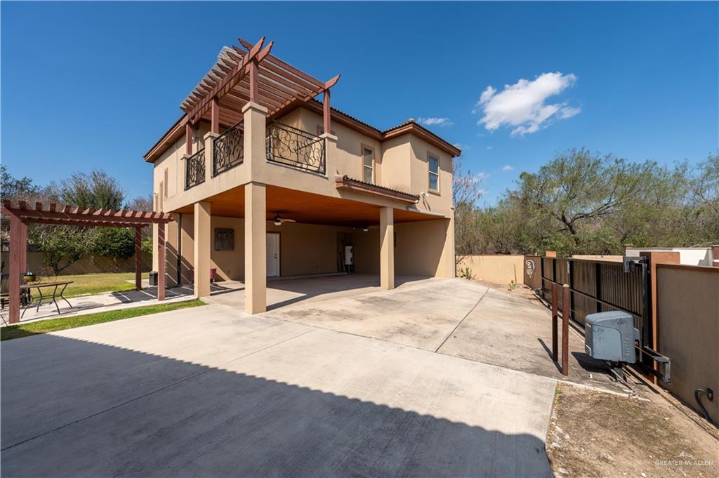 3801 South L Street McAllen, TX 78503 - Photo 32 of 38 a view of a house with a barbeque and wooden stairs