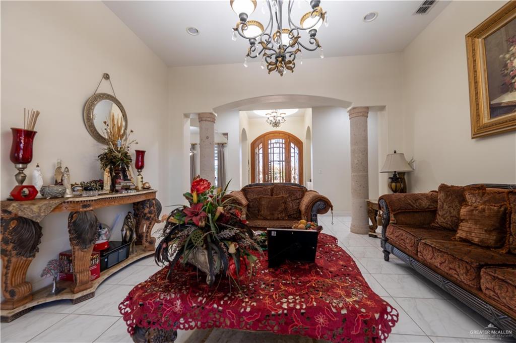 3801 South L Street McAllen, TX 78503 - Photo 5 of 38 a living room with furniture chess board and a chandelier