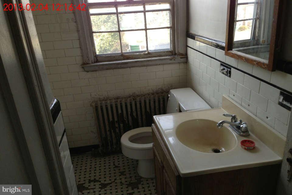 5417 Lothian Road Baltimore, MD 21212 - Photo 3 of 9 a bathroom with a sink and a toilet